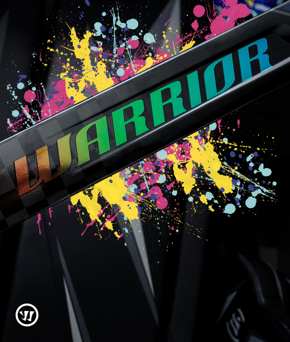 Warrior Covert QR goalie stick amid paint-splatter chaos